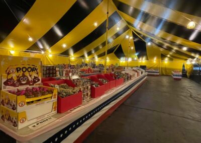 Inside view of a fully stocked fireworks tent, offering a wide selection of fireworks near me in Missouri for 4th of July celebrations.