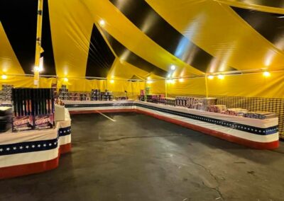 Inside view of a fully stocked fireworks tent, offering a wide selection of fireworks near me in Missouri for 4th of July celebrations.